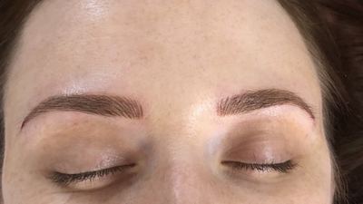 Healed microblading result, both brows, eyes closed, freckled skin